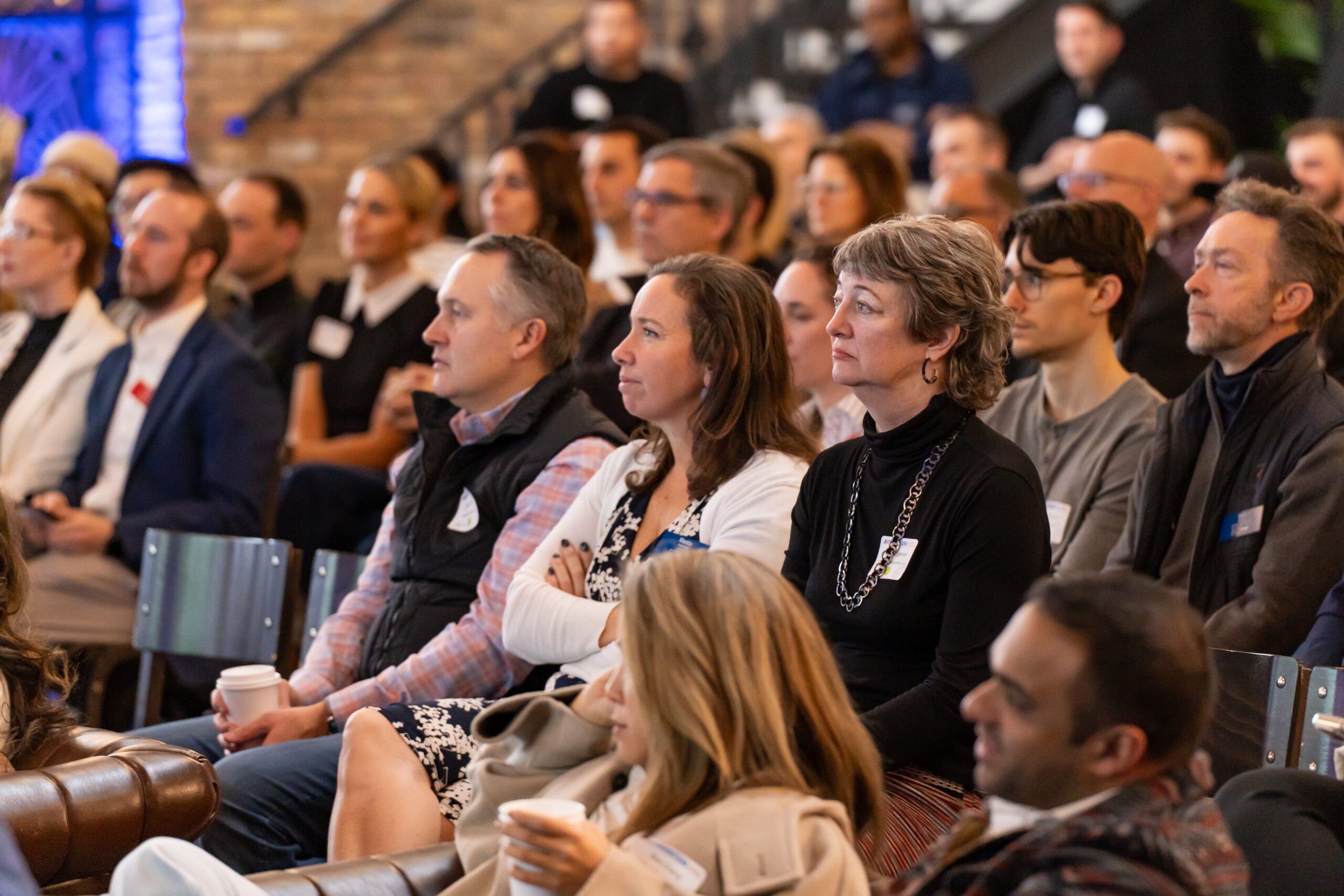 Entrepreneurs listening together at a previous EO event